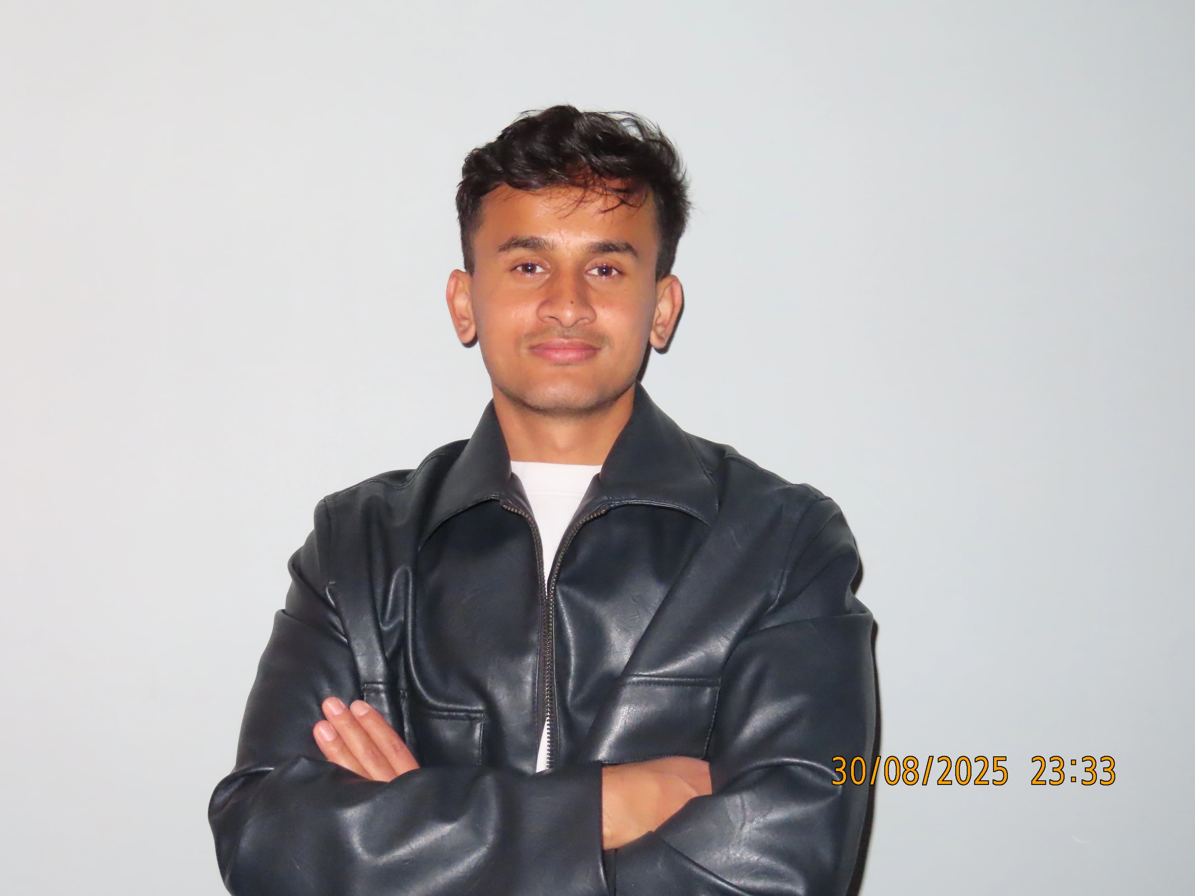 Person peeking from behind the laptop.